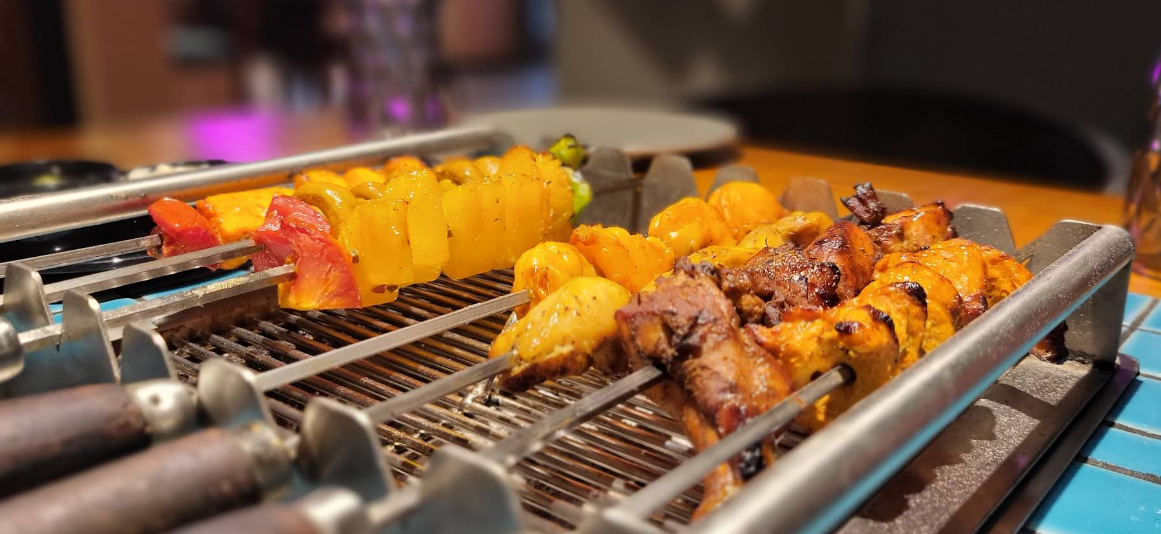 Barbeque skewers grilling at Orange's Barbeque Smoke House